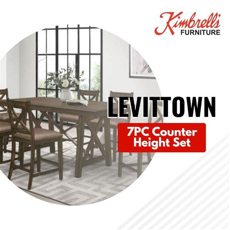 Elevate your dining space with the stunning 7-piece counter height set ...