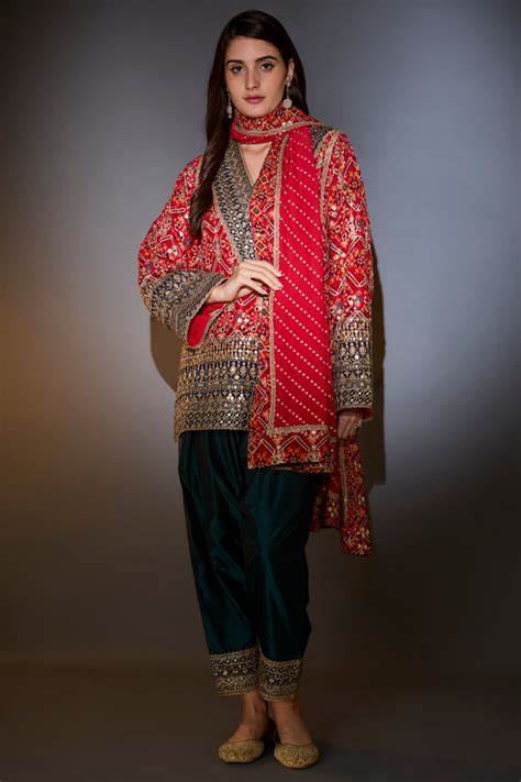 Suit set with short bandhni kurta with intricate aari work, paired with ...