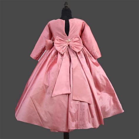 Girls Peachish Pink Birthday Gown with Bow