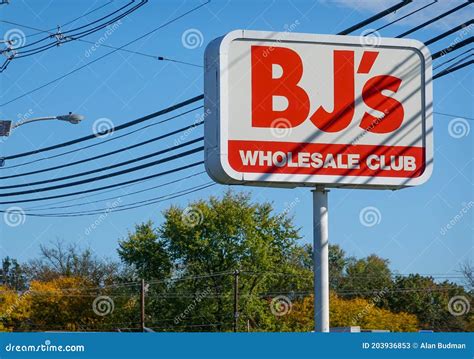 A Red Sign for BJ`s Wholesale Club As Seen on the Side of a Road Near a Club Location Editorial ...