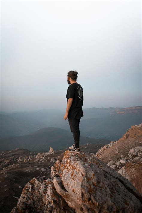 Man Standing On Rock Photos, Download The BEST Free Man Standing On ...
