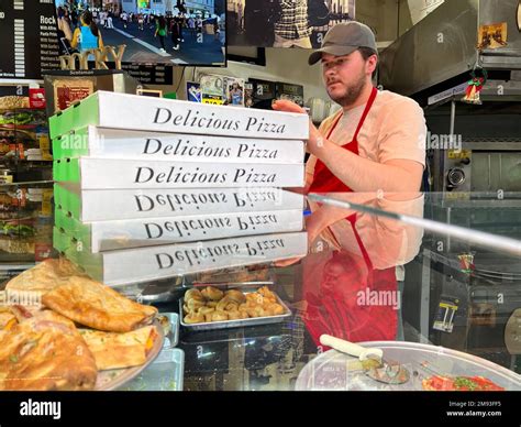 Stack of large pizzas ready for delivery from Rocky's Pizzeria in ...
