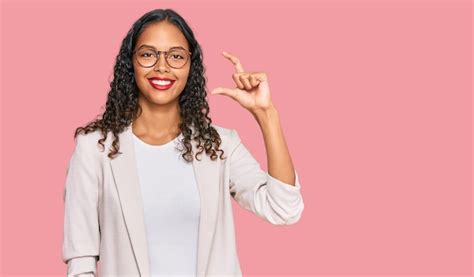 Young african american girl wearing business clothes smiling and ...