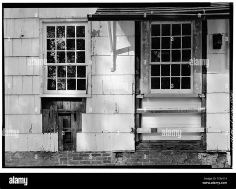 Original window on right being re-installed, on northeast corner of ...