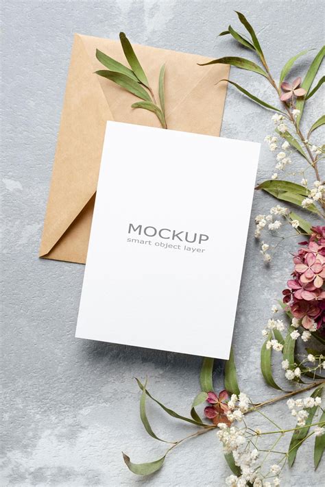 Blank wedding invitation card mockup with envelope and flowers ...