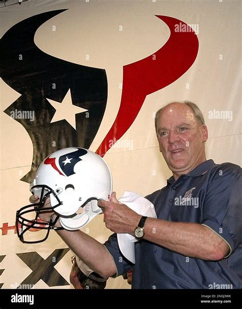 Houston Texans owner Bob McNair poses with the new team's logo and ...