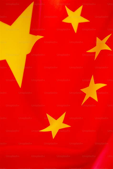 A red and yellow flag with stars on it photo – China Image on Unsplash
