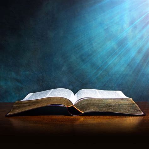Download Open Bible With Light Rays | Wallpapers.com