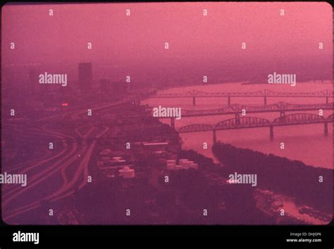 This image captures smog hanging over Louisville, Kentucky, and the Ohio River. Smog, a form of ...