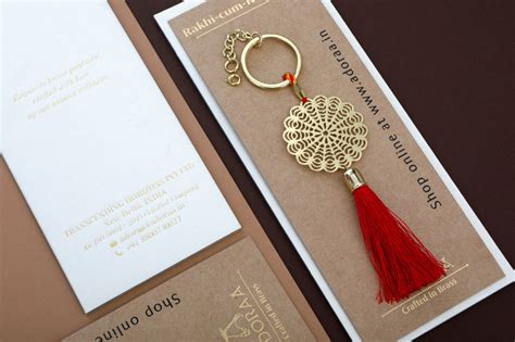 Floral design Rakhi for bhabhi with red hanging tassel cum keychain ri ...