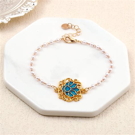 Serenity Lotus Blue Charm Gold Bracelet | Salty – Salty Accessories