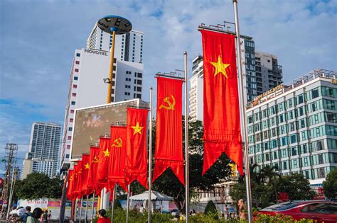 Flags of Vietnam and Communist flags with a hammer and sickle on ...
