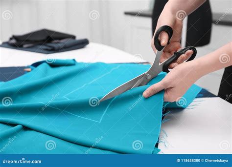 Seamstress Cutting Fabric at Table Stock Photo - Image of fashion ...