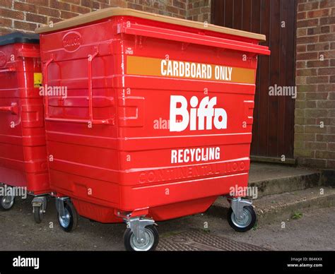 Large Red Industrial Recycling Bins Situated Behind Retail Units Stock ...