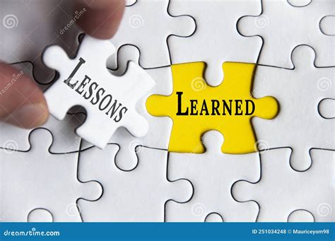 Lessons Learned Text on Jigsaw Puzzle with One Hand Holding a Missing ...