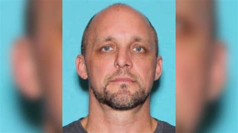Police search a Lansing home for a man wanted for questioning in double ...