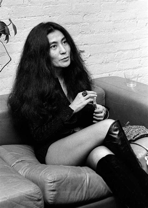 Download Yoko Ono Sitting On Sofa Wallpaper | Wallpapers.com