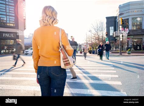 USA Maryland Bethesda Pedestrian safety woman crossing in a crosswalk ...