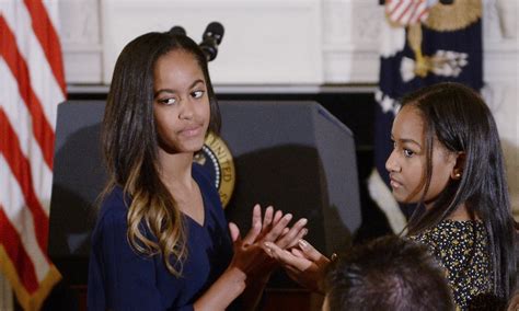 Malia, Sasha Obama Appear In Rare Photo At Album Debut Party