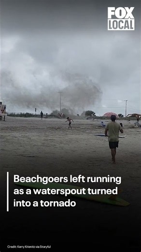 Beachgoers left running as waterspout turns into tornado