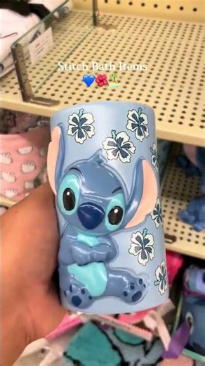 Stitch_blue_alien_character_from_Lilo_and_Stitch_holding_wrapped_gift