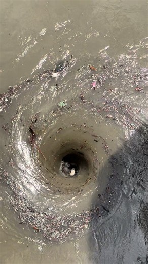 Suction at Spillway Gate Forms Black-Hole Vortex in Reservoir