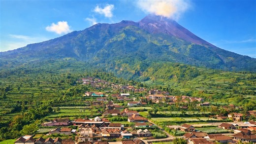 The mountain where villages sit at the foot of an active volcano