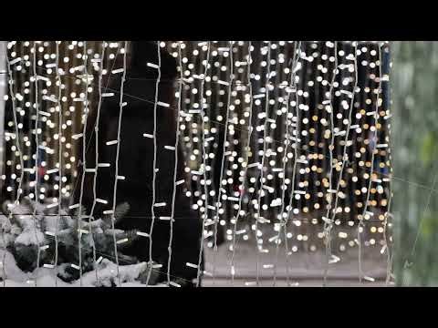 Christmas lights illuminating winter city street with festive bokeh at night