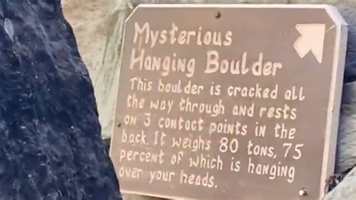 'Mysterious hanging boulder' makes not-so-mysterious hole in walkway