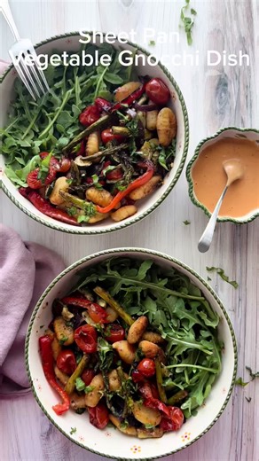 Sheet Pan Gnocchi with Vegetables is a meal prep recipe that is bursting with flavor. Some of the ingredients include plant based gnocchi, green peppers, red onions and grape tomatoes. This recipe has a light sprinkling of vegan parmesan cheese that heightens the flavor. #foodie #vegan #foodporn #healthyfood #cooking,