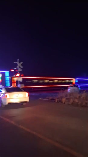 Dazzling Holiday Train Lights Up the Town at Night