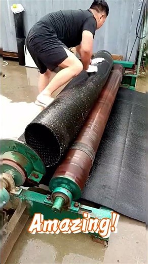 Rolling process of a rubber conveyor belt into a cylinder