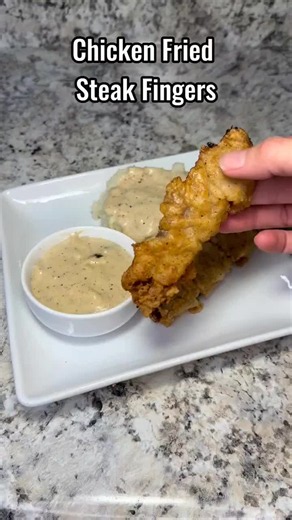 Chicken fried steak fingers (1:04) Chicken fried steak fingers with homemade cream gravy. Texas comfort food done right 🤩 #chickenfriedsteak #texasfood #comfortfood #southerncooking #foodtok