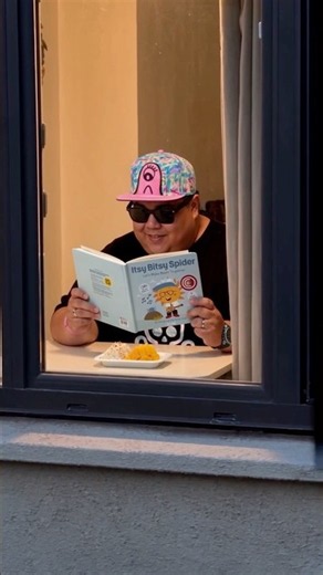 Grown man reading a children’s book because it’s that good.