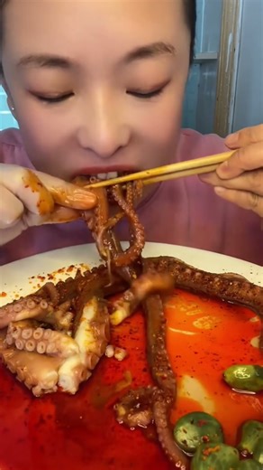 Slurping down this spicy octopus tentacle like a boss #foodshorts #seafood #youtubeshorts #viralfood