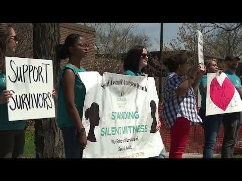 Community members silently demonstrate for Sexual Assault Awareness Month