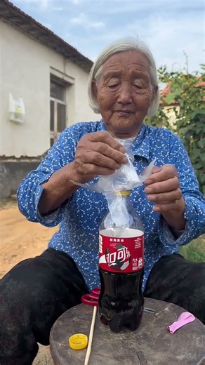 Disposable gloves are innocent, so is cola. Grandma is happy. #RuralLife #Grandma #AmazingLifestyle