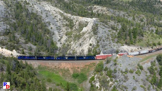 A nice set of power on a BNSF freight on Montana Rail Link's Mullan Pass. The views of trains from ground level are nice enough on their own, but how about from above?! From the 7idea Productions show "Farewell MRL, Part 2, The Helpers of Mullan Pass" https://rfd.video/FarewellMRL2 | Railfan Depot