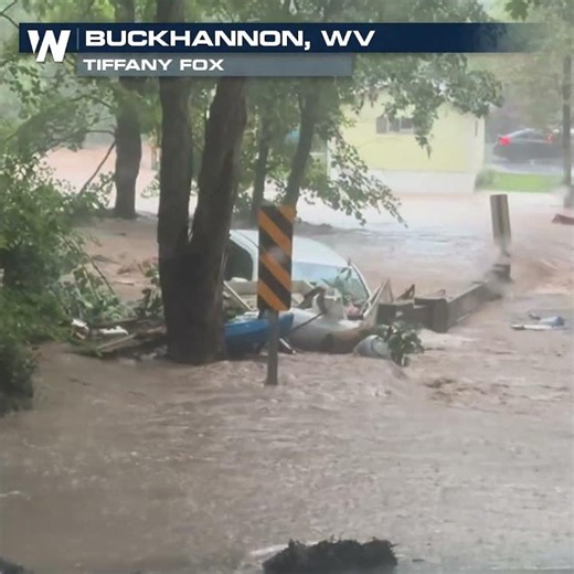 DRAMATIC VIDEO shows car get sucked under bridge in floodwaters!