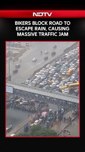 Bikers Block Road To Escape Rain, Causing Massive Traffic Jam
