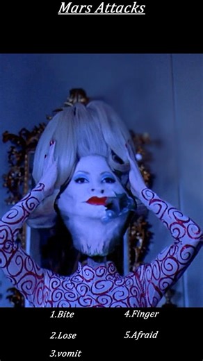 Mars Attacks! (1996) – Alien Disguised as Woman Prepares for Assassination