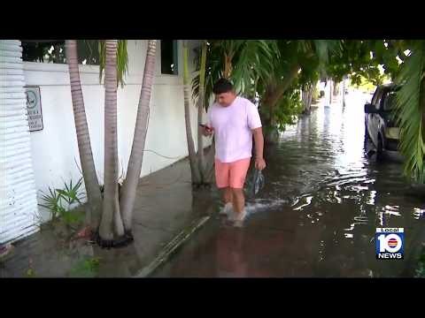 Residents continue to trudge through king tide flood waters in Miami Beach
