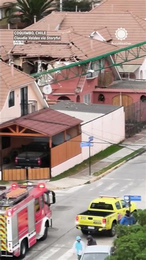 Construction crane collapses onto homes during storm in Chile