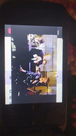 Adam PintauroLevitt is Watching a YouTube Video on an Alcatel Mobile Flip Phone