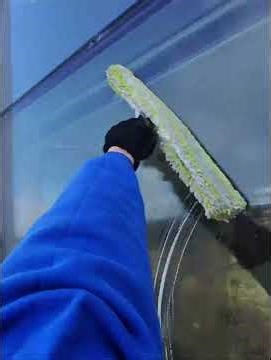 POV short of me cleaning windows on a high rise building.