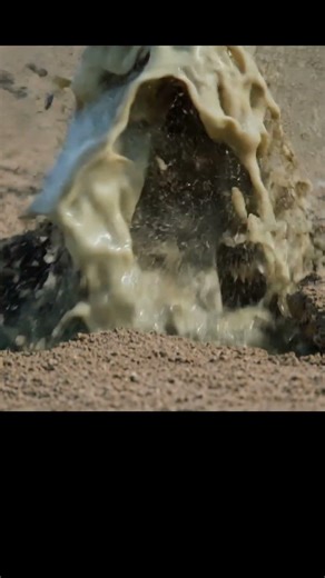 Ground sand blow eruption from liquefaction in farmland.