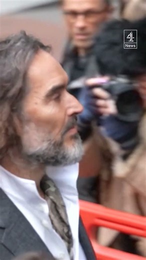 Russel Brand arrives at court for start of rape and sexual assault trial