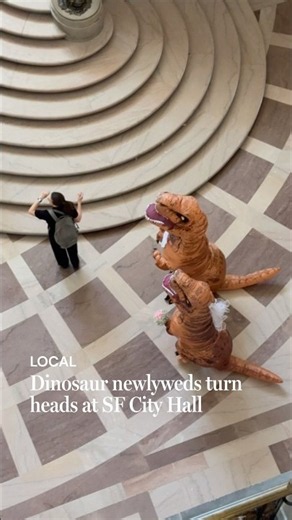 Dinosaur newlyweds turn heads at SF City Hall