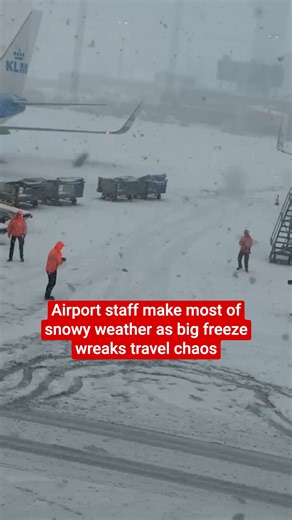 Schiphol staff made the most of the snow in Amsterdam as the cold weather forced mass cancellations from the airport | The Independent
