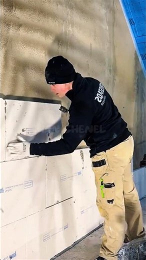 Construction workers install Knauf Insulation panels on the walls.#shorts #construction #shortvideo